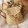 Handcrafted straw backpack in beige with brown leather straps and woven radial pattern - Beige
