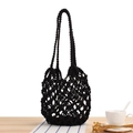 Minimalist black woven mesh shoulder bag featuring a classic hollow crochet pattern - Black