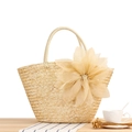 Handmade straw tote bag featuring a large champagne silk flower for beach vacations - Natural Wheat