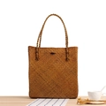 Brown woven straw shoulder bag with dark button closure in a minimalist rustic design - Honey Yellow