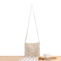 Bohemian off-white macrame shoulder bag featuring handmade woven fringe and cotton texture - White