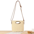 Straw woven crossbody bag in beige with oval metal handle and brown leather strap - Beige