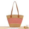 Large woven tote bag with red stripes and brown leather handles on a wooden table - Red Stripes (Camel)