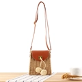Vintage paper rope woven crossbody beach bag with pom-poms and brown leather flap - Camel