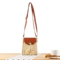 Vintage paper rope woven crossbody bag in cream white with brown leather trim and pom poms - Beige