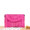 Handmade corn husk straw envelope clutch bag in vibrant magenta for beach vacations - Rose Red