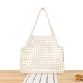 Ivory hollow cotton rope crochet tote bag for women shown on a wooden table - White