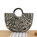 Handmade bicolor straw handbag with black circular handles in a casual woven paper rope style - Black