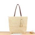 Beige gewebte Stroh-Shopper-Tasche mit braunen Ledergriffen und dekorativer Quaste - Beige