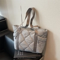 Grey quilted tote bag with diamond stitching and side zippers for autumn commute - Gray