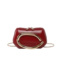 Glossy red leather mini bag with large gold C-shaped buckle and metal snake chain strap - Red