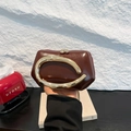 Burgundy patent leather handbag with gold metal handle and geometric trapezoidal shape - Brown
