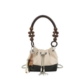 Detail of suede bucket bag featuring contrast stitching, wooden bead handle and metal chain - No Pendant / White