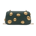 Detail view of dark green evening bag with luxury gold pebble-shaped metal accents - Dark Green