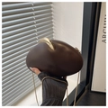 Detail of a dark coffee pebble-shaped PU box clutch with a gold chain strap and metal lock - Brown