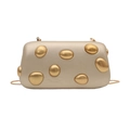 Detail of champagne gold evening bag with metallic oval textures and a slim chain strap - Gold