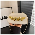 Detail of off-white evening bag featuring gold wave clasp and fine chain strap - White