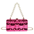 Detail of rose red metallic evening clutch with 3D grid texture and pearl handle - Rose Red