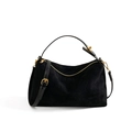 Detail of black quilted suede handbag with gold zipper and adjustable shoulder strap - Black