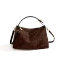 Brown suede tote bag with diamond lattice pattern and golden hardware on white background - Coffee