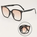 Faltbare Oversize-Sonnenbrille in Mattschwarz mit Verlaufsgläsern und kompaktem Design - Schwarzer Rahmen Verlaufsrote Gläser