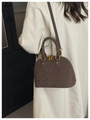 Detail of dark brown shell handbag with gold hardware and removable shoulder strap - Standard Type / Brown