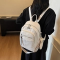 White faux leather backpack with lychee texture and patterned wide shoulder straps - Off White