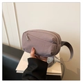 Detail of purple-grey nylon crossbody bag with adjustable strap and front zipper pocket - Gray