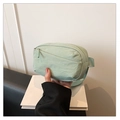 Detail of mint green nylon waist bag with zipper pocket and adjustable strap - Green