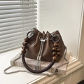 Dark brown PU leather bucket bag with wooden beads and silver tassel detail - Brown