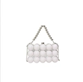Close-up of white beaded evening bag with silver metal trim and elegant beaded handle - Silver