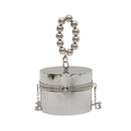 Detailed macro view of silver metallic cylindrical handbag with beaded ring handle and clasp - Silver