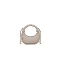 Detail view of crescent acrylic handbag with round handle and gold metal chain strap - Grey-Beige
