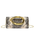 Close-up of snakeskin pattern clutch bag with gold ring buckle and delicate chain strap - Snake Khaki
