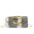 Macro detail of snakeskin pattern leather and gold C-shaped metal clasp on crossbody bag - Snake Print Black
