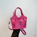 Hot pink gothic crossbody bag with silver cross decoration and pebble texture leather - Rose Red