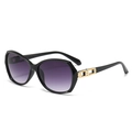 Lunettes de soleil noires élégantes à verres dégradés violets et détails dorés - Monture Noire Verres Dégradés Gris