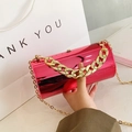 Hot pink metallic cylindrical clutch bag with gold chain handles and crossbody strap - Rose Red