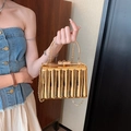 Elegant gold acrylic evening clutch with vertical wave texture and metal handle - Vertical Stripe Gold