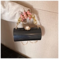 Detail of cylinder acrylic clutch bag with gold chain handle and large pearl clasp - Black