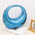 Detail of blue metallic mirror acrylic moon bag with asymmetrical ring handle design - Blue