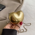 Mini golden heart-shaped acrylic crossbody bag with shiny metallic mirror finish and chain - Gold