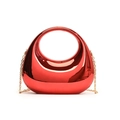 Detail of red acrylic box bag featuring round cutout handle and gold chain strap - Red