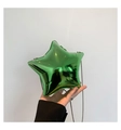 Detail of green star-shaped acrylic clutch bag with metallic glossy finish and chain - Green