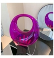 Detailed macro view of purple translucent acrylic crescent handbag with silver chain - Fluorescent Purple