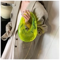 Neon yellow acrylic box clutch with gold chain strap styled on a beige blazer - Fluorescent Green