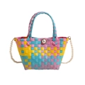 Colorful woven handbag with vibrant checkerboard pattern and luxury pearl shoulder strap - Blue
