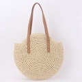 Minimalist round woven straw tote bag with tan leather handles for summer beach vacations - Beige