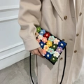 Handmade crochet crossbody bag in black with vibrant multi-colored 3D floral patterns - Black