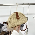 Beige woven straw crossbody bag with dark brown leather flap and metal snap closure - Off White